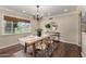 Bright dining room with hardwood floors, modern furnishings, and natural light at 709 E Hayward Ave, Phoenix, AZ 85020