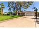 Exterior of the home with a long driveway and a basketball hoop near the street at 709 E Hayward Ave, Phoenix, AZ 85020
