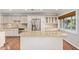 Modern kitchen features stainless steel appliances, granite countertops, and a central island at 709 E Hayward Ave, Phoenix, AZ 85020