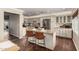 Bright kitchen boasts granite countertops, an island with seating, and stainless steel appliances at 709 E Hayward Ave, Phoenix, AZ 85020
