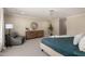 Spacious main bedroom offers a sitting area, neutral decor, and a decorative chandelier at 709 E Hayward Ave, Phoenix, AZ 85020