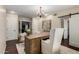 Bright home office with hardwood floors, a desk, and a sliding barn door, perfect for working from home at 709 E Hayward Ave, Phoenix, AZ 85020