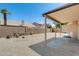 Low maintenance backyard with covered patio, gravel, and block wall at 720 W Palo Verde St, Gilbert, AZ 85233