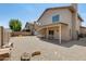 Backyard view of a covered patio and low-maintenance gravel landscape at 720 W Palo Verde St, Gilbert, AZ 85233
