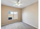 Cozy bedroom featuring plush carpet, a ceiling fan, and a window providing natural light at 720 W Palo Verde St, Gilbert, AZ 85233