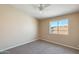 Cozy bedroom featuring neutral tones, carpeted floors, and a window with a view at 720 W Palo Verde St, Gilbert, AZ 85233