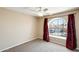 Cozy bedroom featuring arched window with red curtains, and neutral color scheme at 720 W Palo Verde St, Gilbert, AZ 85233