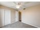 Bright bedroom with plush carpet, closet, and ceiling fan at 720 W Palo Verde St, Gilbert, AZ 85233