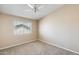 Cozy bedroom featuring neutral tones, carpeted floors, and a window at 720 W Palo Verde St, Gilbert, AZ 85233
