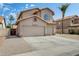 View of the charming two-story house featuring a tile roof and three car garage at 720 W Palo Verde St, Gilbert, AZ 85233