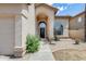 Close up of the front door and desert landscaping on the exterior at 720 W Palo Verde St, Gilbert, AZ 85233