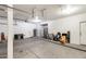 Spacious garage with high ceilings, storage, and side door at 720 W Palo Verde St, Gilbert, AZ 85233