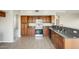 Charming kitchen features stainless steel appliances and granite countertops at 720 W Palo Verde St, Gilbert, AZ 85233
