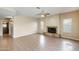 Bright living room with a stone fireplace and neutral tile flooring, offering a cozy and inviting space at 720 W Palo Verde St, Gilbert, AZ 85233
