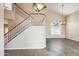 Inviting living room featuring a staircase with decorative wrought iron and wood banister at 720 W Palo Verde St, Gilbert, AZ 85233