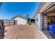 Rear view of the house, showcasing the backyard and detached garage area at 7210 W Caron Dr, Peoria, AZ 85345