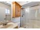 Bathroom with glass shower and vanity with cabinet at 7210 W Caron Dr, Peoria, AZ 85345