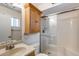 Bathroom with glass shower and vanity with cabinet at 7210 W Caron Dr, Peoria, AZ 85345