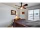 Bedroom featuring a ceiling fan and a window with blinds at 7210 W Caron Dr, Peoria, AZ 85345