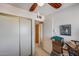 Bedroom with sliding closet doors, ceiling fan, and white walls at 7210 W Caron Dr, Peoria, AZ 85345