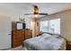 Bedroom with window, ceiling fan, and dresser at 7210 W Caron Dr, Peoria, AZ 85345