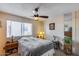 Bedroom with window, ceiling fan, and neutral paint at 7210 W Caron Dr, Peoria, AZ 85345