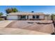 Charming single-story home with a two-car garage and low maintenance landscaping at 7210 W Caron Dr, Peoria, AZ 85345