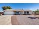 Charming single-story home with a two-car garage and low maintenance landscaping at 7210 W Caron Dr, Peoria, AZ 85345