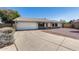 Charming single-story home with a two-car garage and low maintenance landscaping at 7210 W Caron Dr, Peoria, AZ 85345