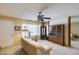 Bright living room featuring a ceiling fan, a large window and built in shelving at 7210 W Caron Dr, Peoria, AZ 85345