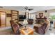Cozy living room features a brick fireplace, built-in shelving, and comfortable seating at 7210 W Caron Dr, Peoria, AZ 85345