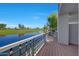 Balcony view overlooking the serene lake and lush golf course on a bright sunny day at 7272 E Gainey Ranch Rd # 23, Scottsdale, AZ 85258