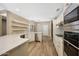 Bright kitchen with stainless steel appliances, a spacious countertop, and ample storage at 7272 E Gainey Ranch Rd # 23, Scottsdale, AZ 85258
