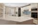 Modern kitchen featuring stainless steel appliances, custom cabinets, and a large counter bar at 7272 E Gainey Ranch Rd # 23, Scottsdale, AZ 85258