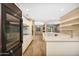 Modern kitchen showcasing stainless steel appliances, cabinetry, and open access to living spaces at 7272 E Gainey Ranch Rd # 23, Scottsdale, AZ 85258