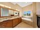 Elegant bathroom with dual vanities, marble countertops, soaking tub, and fireplace at 7272 E Gainey Ranch Rd # 23, Scottsdale, AZ 85258