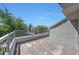 Outdoor patio with nice view and metal safety railing on a sunny day at 7272 E Gainey Ranch Rd # 23, Scottsdale, AZ 85258