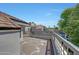 Wide patio with community views, metal railings, and sun-drenched deck at 7272 E Gainey Ranch Rd # 23, Scottsdale, AZ 85258