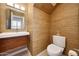 Stylish powder room with floating vanity, vessel sink, and textured wallpaper at 7272 E Gainey Ranch Rd # 23, Scottsdale, AZ 85258