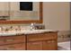 Bathroom vanity with granite countertop, updated fixtures, and ample storage at 7272 E Gainey Ranch Rd # 23, Scottsdale, AZ 85258