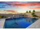 Backyard swimming pool featuring a stunning water feature and beautiful desert landscaping, perfect for relaxation and enjoyment at 826 E Buist Ave, Phoenix, AZ 85042