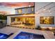 Outdoor living space offering patio seating and a dining area, complemented by string lights and a pool at 826 E Buist Ave, Phoenix, AZ 85042