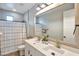 Bright bathroom features a double sink vanity and framed mirror at 826 E Buist Ave, Phoenix, AZ 85042