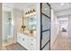 Well-lit bathroom with modern vanity, large mirror, and walk-in shower at 826 E Buist Ave, Phoenix, AZ 85042