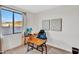 Bedroom featuring a desk and chair and view to the outside at 826 E Buist Ave, Phoenix, AZ 85042