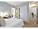 Comfortable bedroom featuring a minimalist design, closet and ensuite bathroom at 826 E Buist Ave, Phoenix, AZ 85042