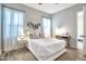 Serene bedroom with a comfy bed, decorative wall hanging, and a bright, airy ambiance at 826 E Buist Ave, Phoenix, AZ 85042