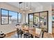Dining room with stylish lighting, a wood table, and views of the outdoor space at 826 E Buist Ave, Phoenix, AZ 85042