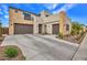 Modern home with stone accents, desert landscaping, and a two-car garage at 826 E Buist Ave, Phoenix, AZ 85042