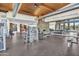 A fitness center with various weightlifting machines, free weights, and a motivational wall mirror at 826 E Buist Ave, Phoenix, AZ 85042